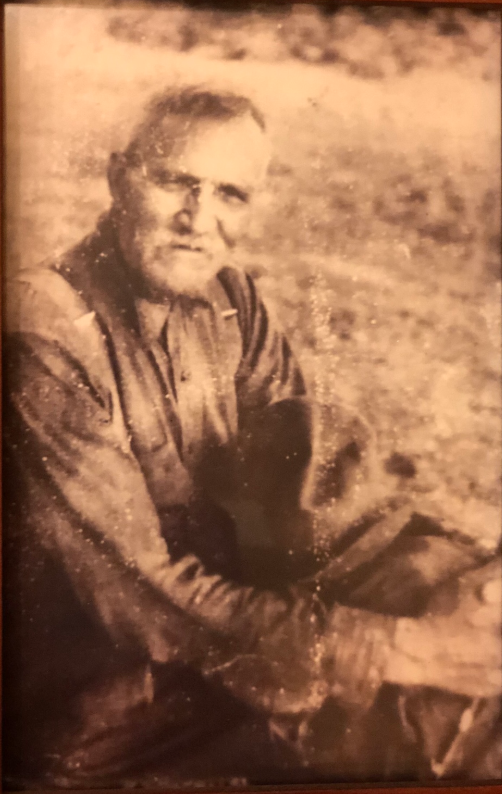 Elder ancestor seated outdoors